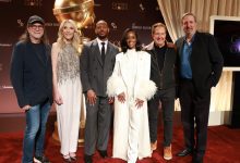 Glenn Weiss, Golden Globes president Helen Hoehne, Marlon Wayans, Skye P. Marshall, Barry Adelman and Ricky Kirshner pose onstage during the nominations announcement and media preview for the 83rd Annual Golden Globes at The Beverly Hilton on Dec. 8.