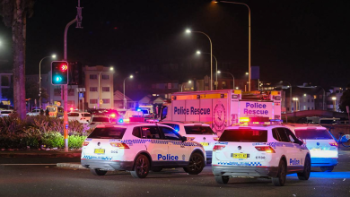 Police cars are seen parked at the scene of a mass shooting at Bondi Beach on Dec. 14, 2025, in Sydney, Australia.