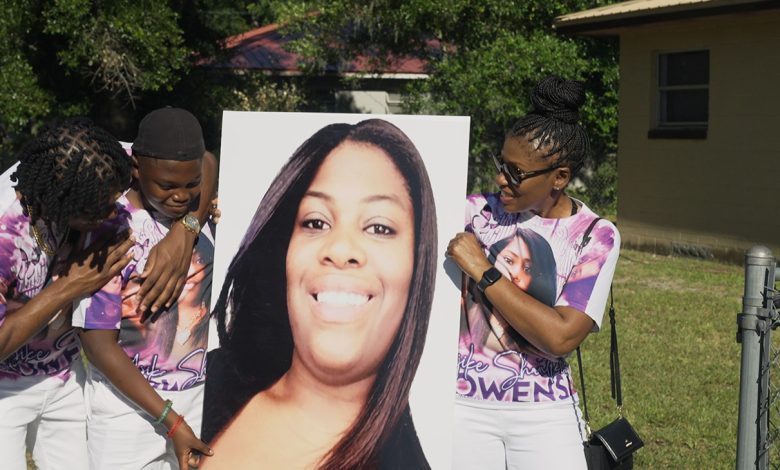 Ajike Owens’ son and mother hold a photo of her in The Perfect Neighbor