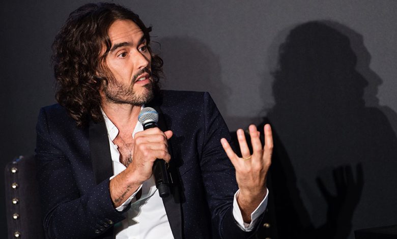Russell Brand speaking at event