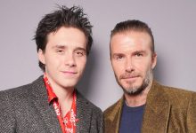 Brooklyn Beckham and David Beckham in the front row