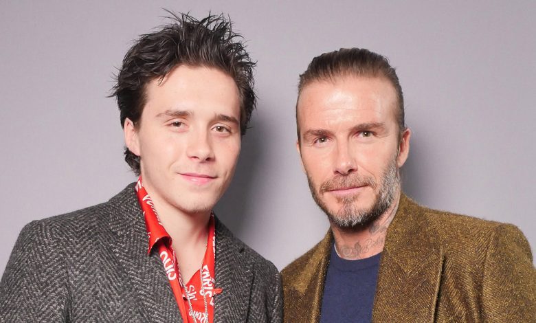 Brooklyn Beckham and David Beckham in the front row