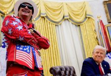 President Donald Trump, accompanied by entertainer Kid Rock, takes a question from a reporter during an executive order signing event in the Oval Office of the White House on March 31, 2025 in Washington, DC.