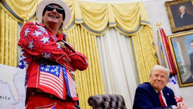 President Donald Trump, accompanied by entertainer Kid Rock, takes a question from a reporter during an executive order signing event in the Oval Office of the White House on March 31, 2025 in Washington, DC.