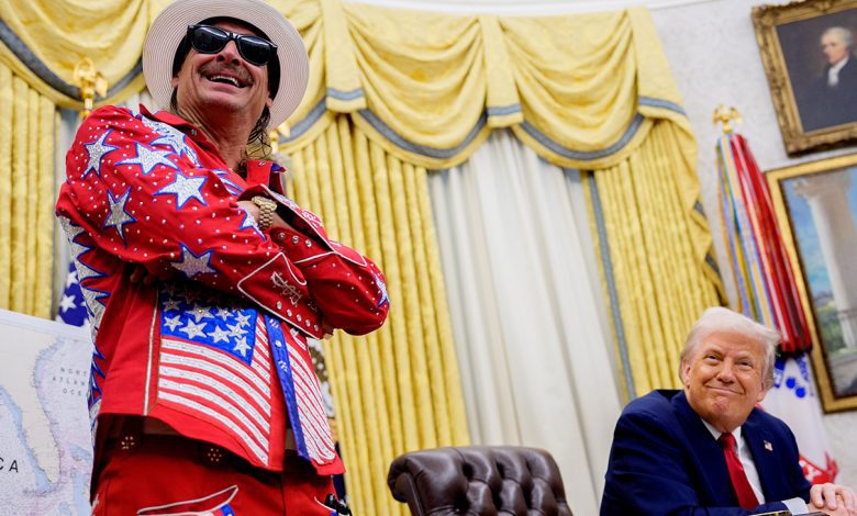 President Donald Trump, accompanied by entertainer Kid Rock, takes a question from a reporter during an executive order signing event in the Oval Office of the White House on March 31, 2025 in Washington, DC.