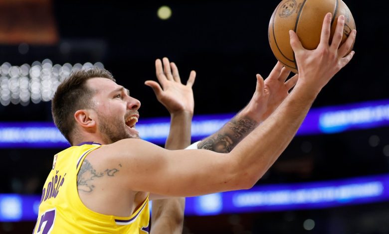 Luka Doncic #77 of the Los Angeles Lakers scores on a layup during the first half against the Charlotte Hornets at Crypto.com Arena on January 15, 2026 in Los Angeles, California.