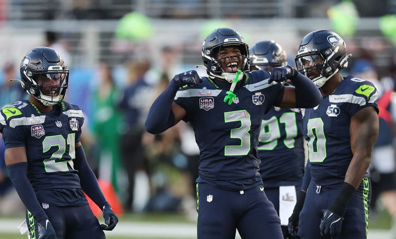Devon Witherspoon (#21) of the Seattle Seahawks and Nick Emmanwori (#3) react to a play during the first quarter of Super Bowl LX against the New England Patriots at Levi