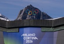 The Olympic Rings are set in front of surrounding mountains at Cortina Curling Olympic Stadium on January 26, 2026 in Cortina d