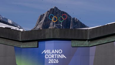 The Olympic Rings are set in front of surrounding mountains at Cortina Curling Olympic Stadium on January 26, 2026 in Cortina d
