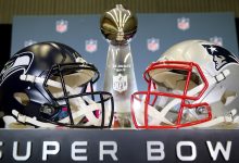 The Vince Lombardi Trophy is framed by the Seattle Seahawks and New England Patriots helmets during Super Bowl LX Opening Night at San Jose McEnery Convention Center on February 2, 2026 in San Jose, California.