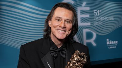 Jim Carrey poses with the Honorary Cesar Award backstage during the 51st Cesar Film Awards at L