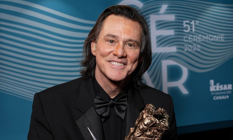 Jim Carrey poses with the Honorary Cesar Award backstage during the 51st Cesar Film Awards at L