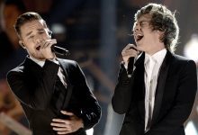 Liam Payne (L) and Harry Styles of One Direction perform onstage during the 2013 American Music Awards at Nokia Theatre L.A. Live on November 24, 2013 in Los Angeles, California.